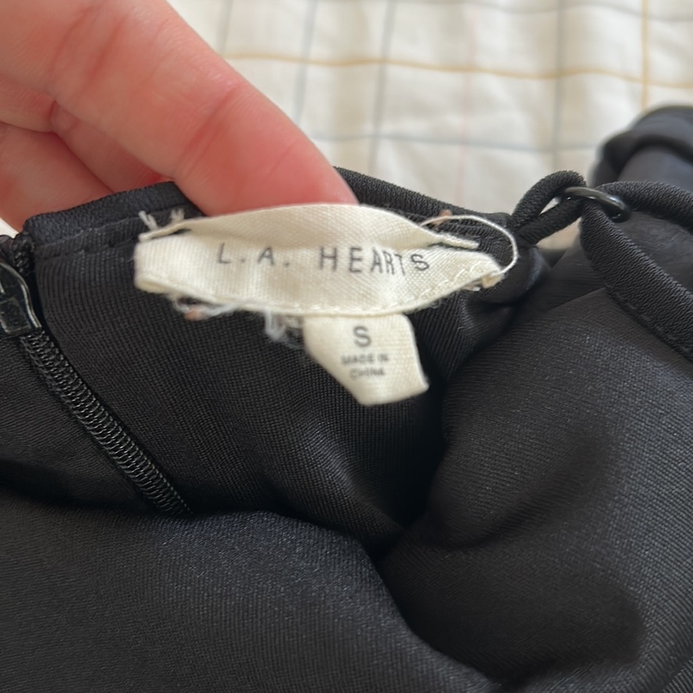 A black dress with cute ruffles and shape to the body - Picture 3 of 4